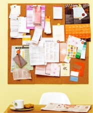 This is a photo of a corkboard hanging on the wall This is a photo of a corkboard hanging on the wall